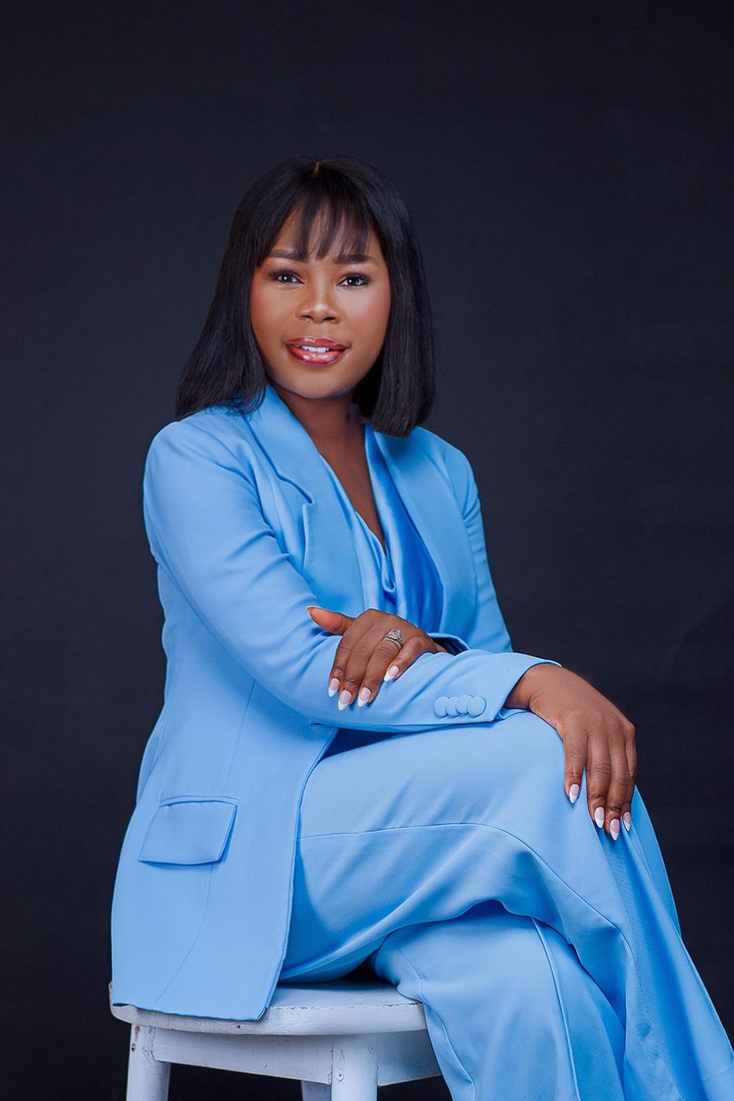 Portrait of Mercy Aisosa, AI Data Annotation and Quality Specialist, wearing a light blue suit